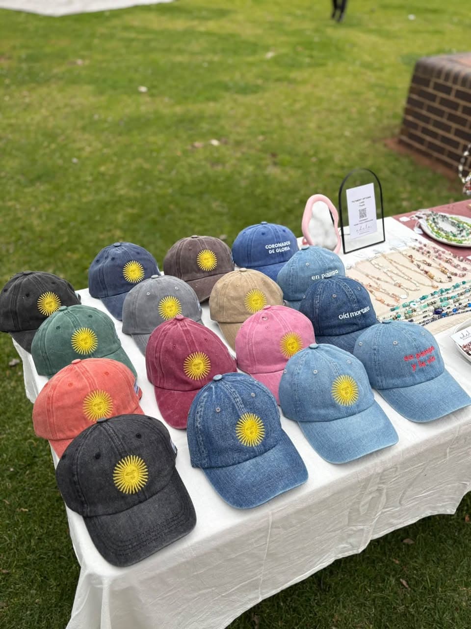 Caps with embroidered designs for sale, $35 each